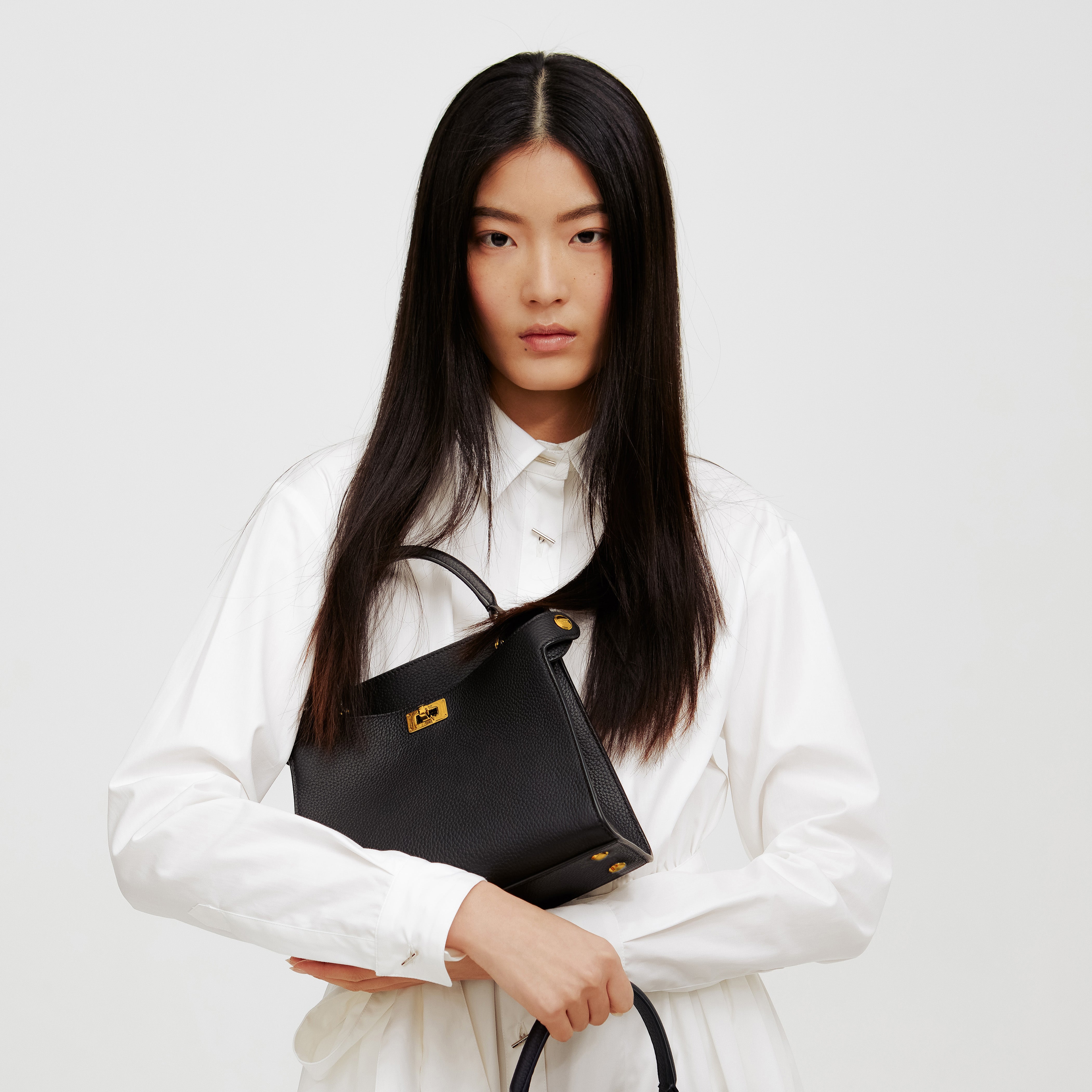 LEATHER HANDBAG LUTECE MINI BLACK GOLD HARWARE