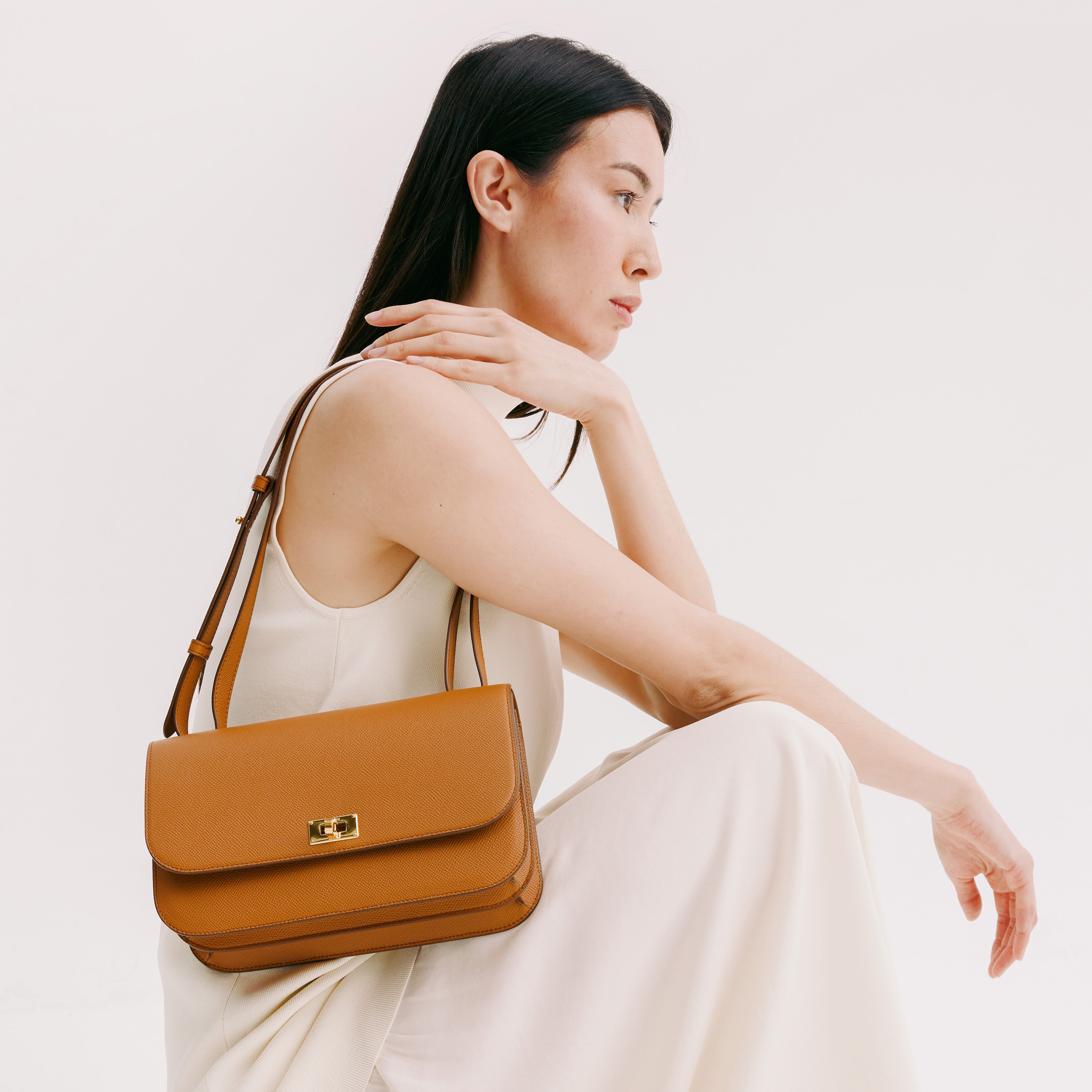 ELYSÉE EAST/WEST GOLD LEDER-KLAPPTASCHE